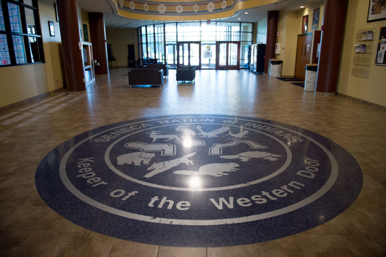 A floor decoration depicts the eight clans of the Seneca Nation at the Cattaraugus Community Center. The Seneca are the "Keepers of the Western Door" for the Confederacy of the Iroquois, a confederacy of six First People Nations.