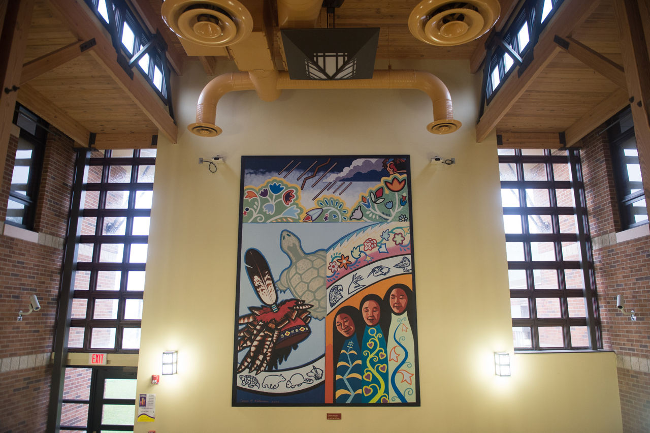 Mural depicting the healing traditions of the Seneca people at the Cattaraugus Wellness Center.