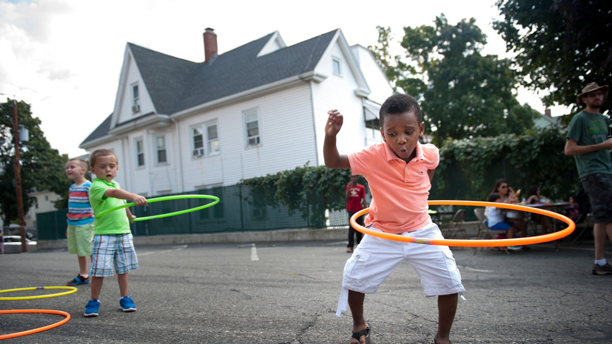Isaiah Ricardi Jean, 5, works on his hula hooping skills during a block party sponsored by the One Everett organization on Sunday afternoon, August 30, 2015. The block party included a bbq, musical performances, games for children, and tables for community organizations.