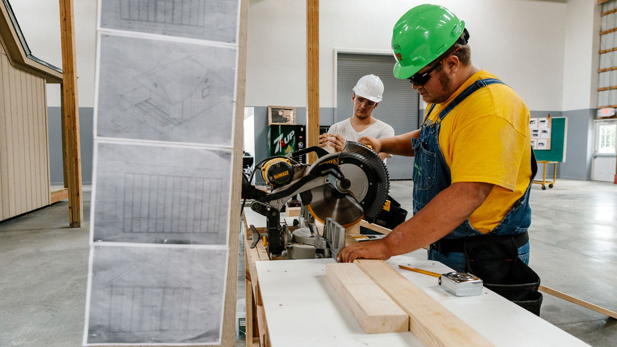 La Harpe, KS - July 31, 2017 - Christian Jackson (17) and Kiefer Endicott work at the Regional Technology Center, established by Ray Maloney and winner of the 2016 Thrive Allen County award for community excellence.