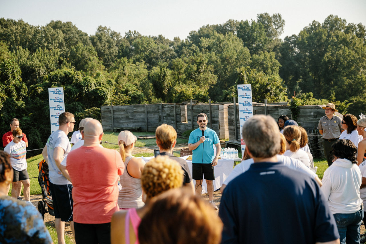 Carlos Latorre speaks to a crowd before a community event. 