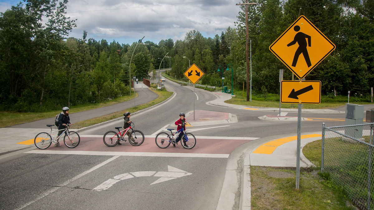 Group riding bikes in Alaska.