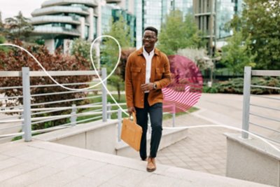 Confident young adult walking to class.