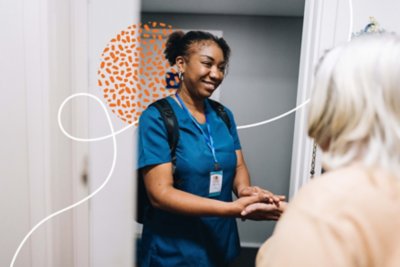 Health-professional checking on patient at home.