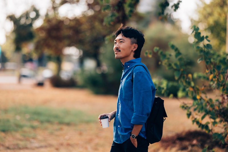 Person gardening and smiling.