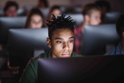 Student looking at computer in class
