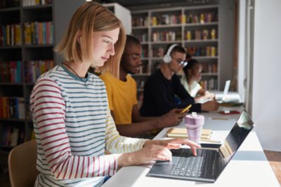 Student on computer studying in library