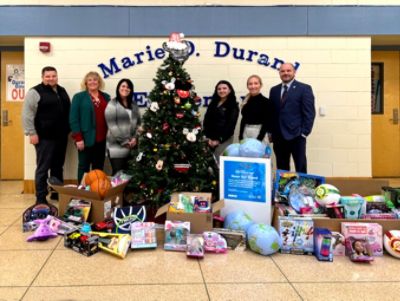 RK Subaru makes a toy drive donation to Marie Durand Elementary School.
