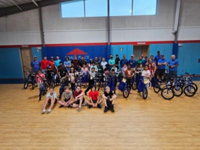 Collaborating to give underprivileged children bikes
