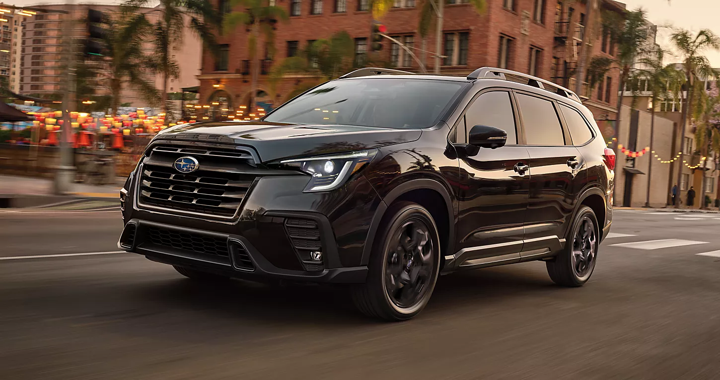 2023 Subaru Ascent Onyx Edition Limited shown in Crystal Black Silica, driving through a city street
