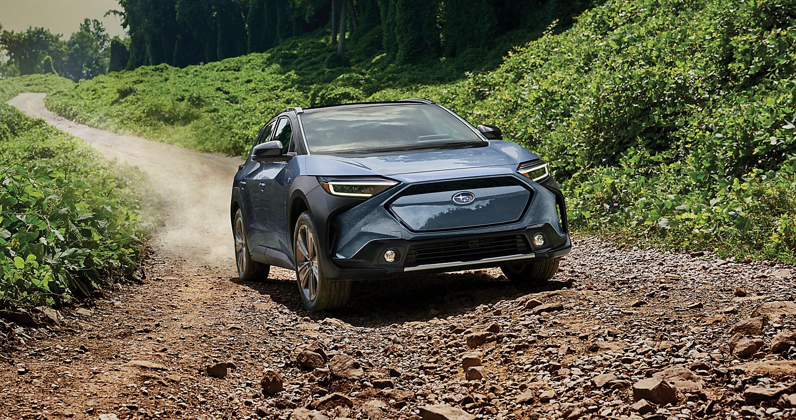 A 2023 Solterra driving on a rugged dirt road.