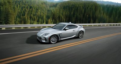 The all-new 2024 Subaru BRZ drives on an open road in Toms River