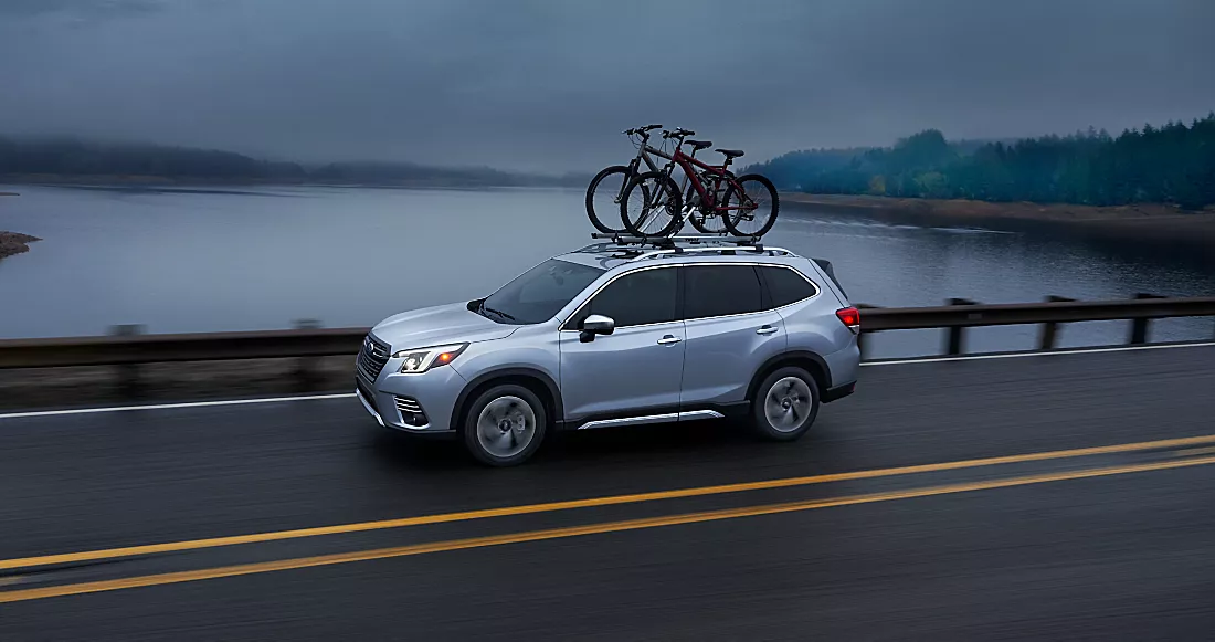  Silver 2024 Subaru forester transporting two large bikes on the bike rack