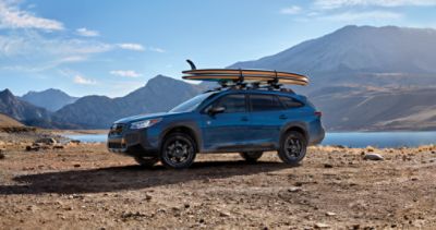 Blue Offroad SUV Car with Roof Trunk on Background of Very