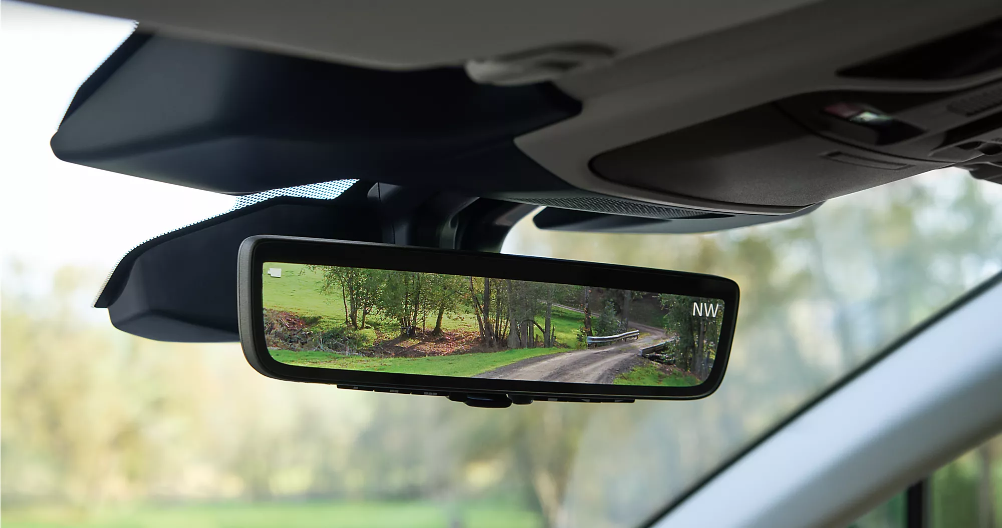  2024 outback Smart rear view mirror with a view of a empty street