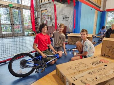 Collaborating to give underprivileged children bikes