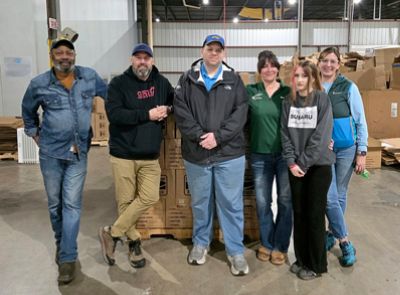 Dutch Miller Helps Box Food for Seniors