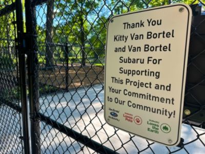 Showing our love for the earth and pets by donating trees and planting them in the new dog park.