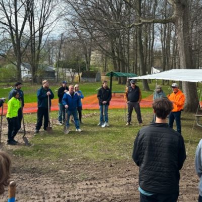 Showing our love for the earth and pets by donating trees and planting them in the new dog park.