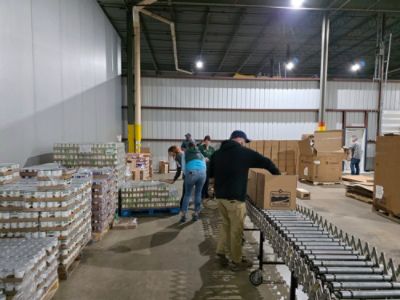 Dutch Miller Helps Box Food for Seniors