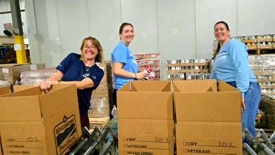 Dutch Miller Subaru Packages Food for Local Seniors