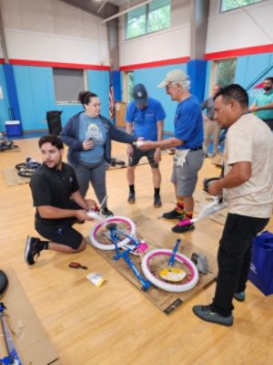 Collaborating to give underprivileged children bikes