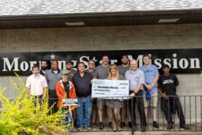 Hawk Subaru helps Subies of the Corn raise $3,000 to help provide meals and care for area homeless.
