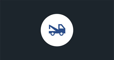 A blue tow truck icon in a white circle representing the MySubaru roadside assistance feature.