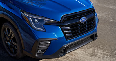 The front grille and bumper of a 2027 Subaru Ascent family SUV.