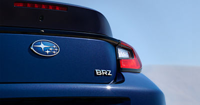 The Subaru logo and BRZ badge on the trunk of a 2027 BRZ 2-door sports car.