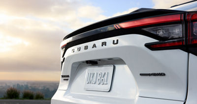 The rear hatch of a white 2027 Subaru Solterra AWD EV.