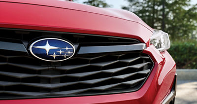 Close-up of a 2026 Impreza front grille and Subaru badge