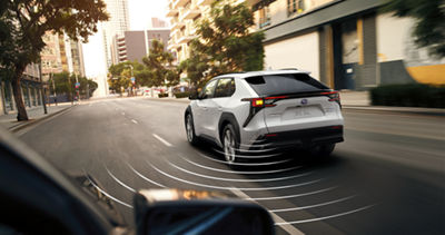 A Solterra project arcs from its rear bumper representing Driver Focus Distraction Mitigation.