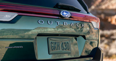 The Outback Logo on the rear cargo hatch of a 2026 Subaru Outback AWD SUV.