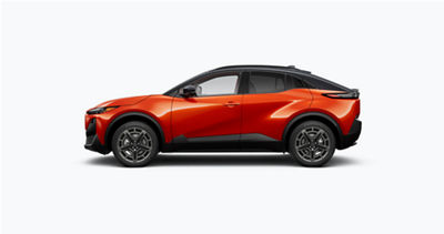 An orange Subaru Uncharted EV on a gray background.