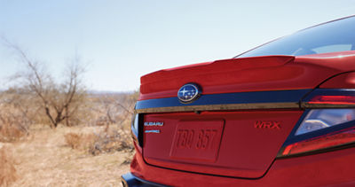 The rear bumper and spoiler of a 2026 Subaru WRX 4-door sports sedan.