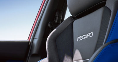A blue-trimmed Recaro front seat in a 2026 WRX tS. sports sedan.