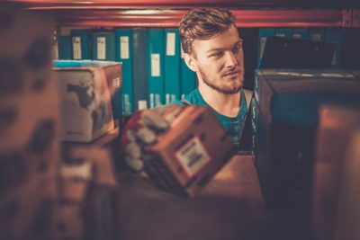 Worker on a automotive spare parts warehouse 