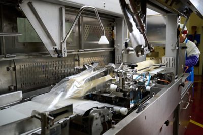 cryoac BL75 automated bag loader loading cheese block