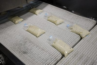 flexprep pouches on conveyor belt