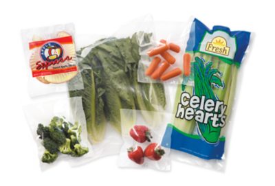pre-opened plastic bags containing various fruits and vegetables