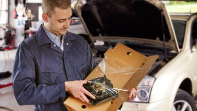 auto mechanic unpacking box