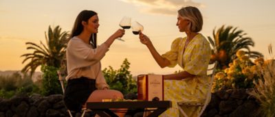 two women drinking wine