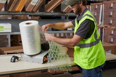 warehouse operator using BUBBLE WRAP universal inflator system