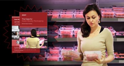 woman in yellow shirt at a grocery store examining cases of fruit