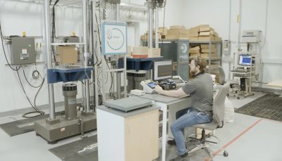 man performing testing in a warehouse