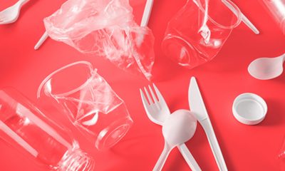 plastic waste on red background