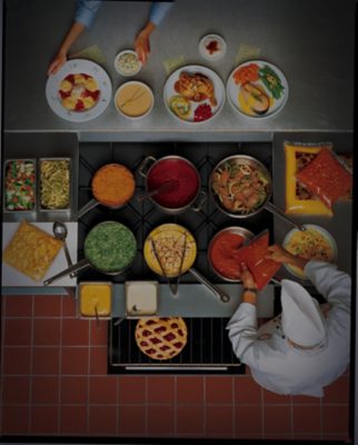 overhead view of chefs making sauces