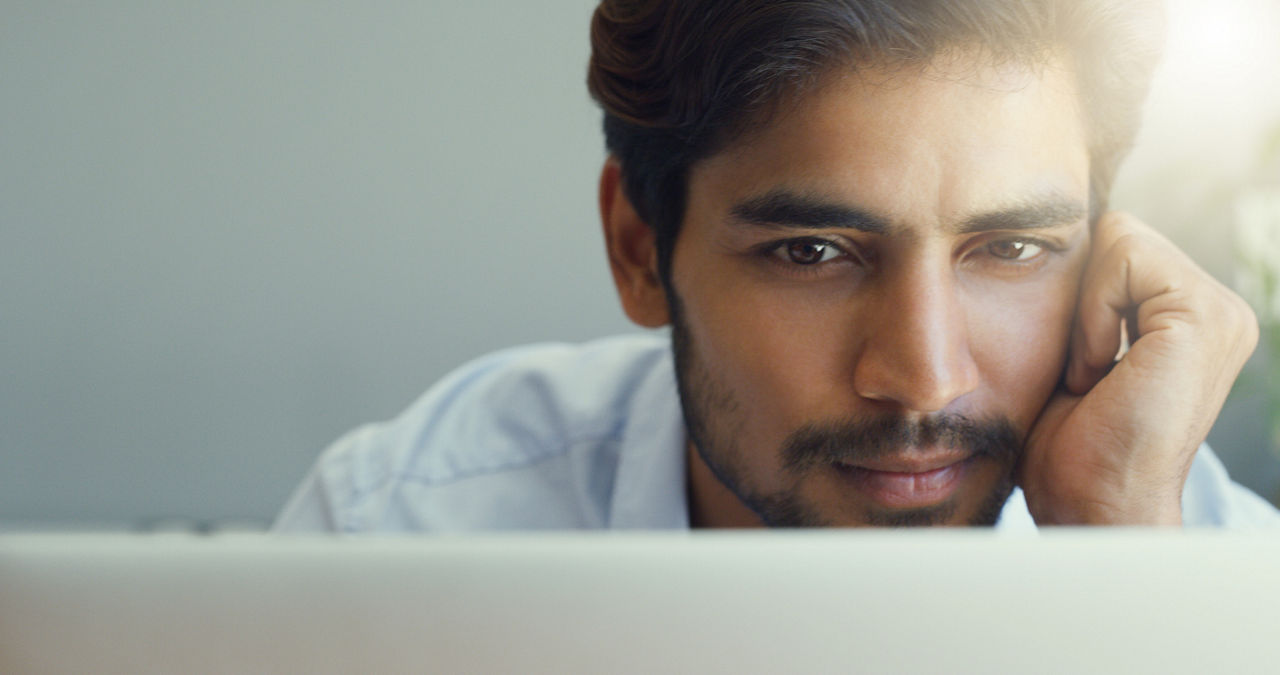 Cropped shot of a businessman working on his laptop