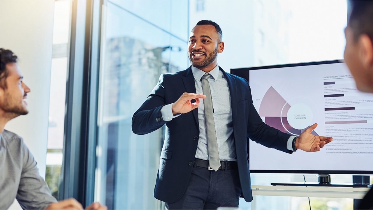 Executives discusses the data in graphs with his team.